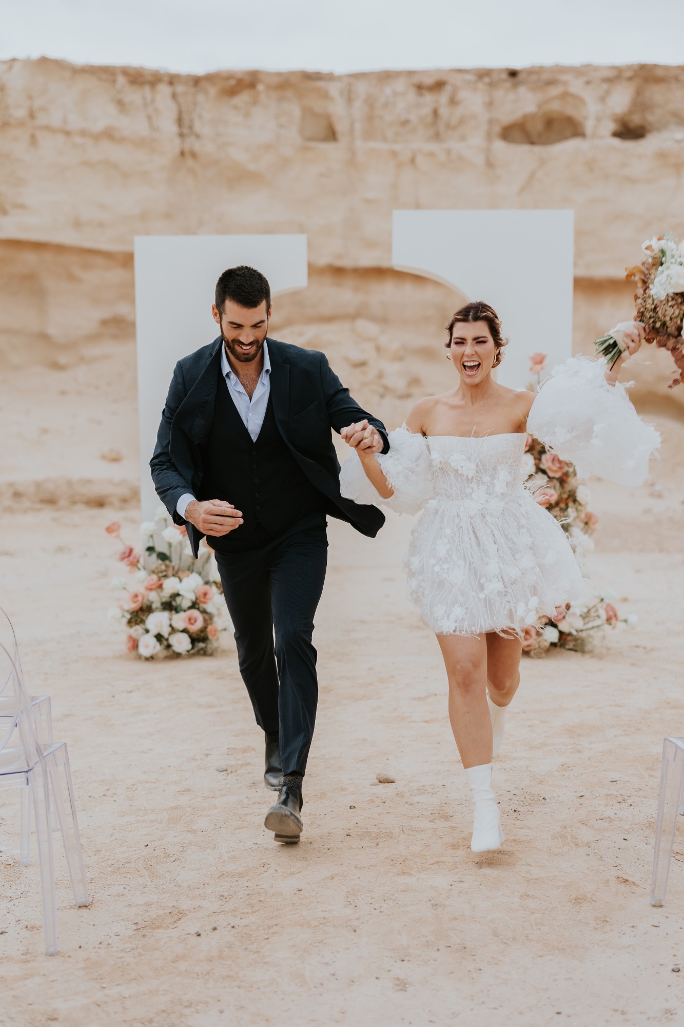 bride and groom desert wedding with pastels