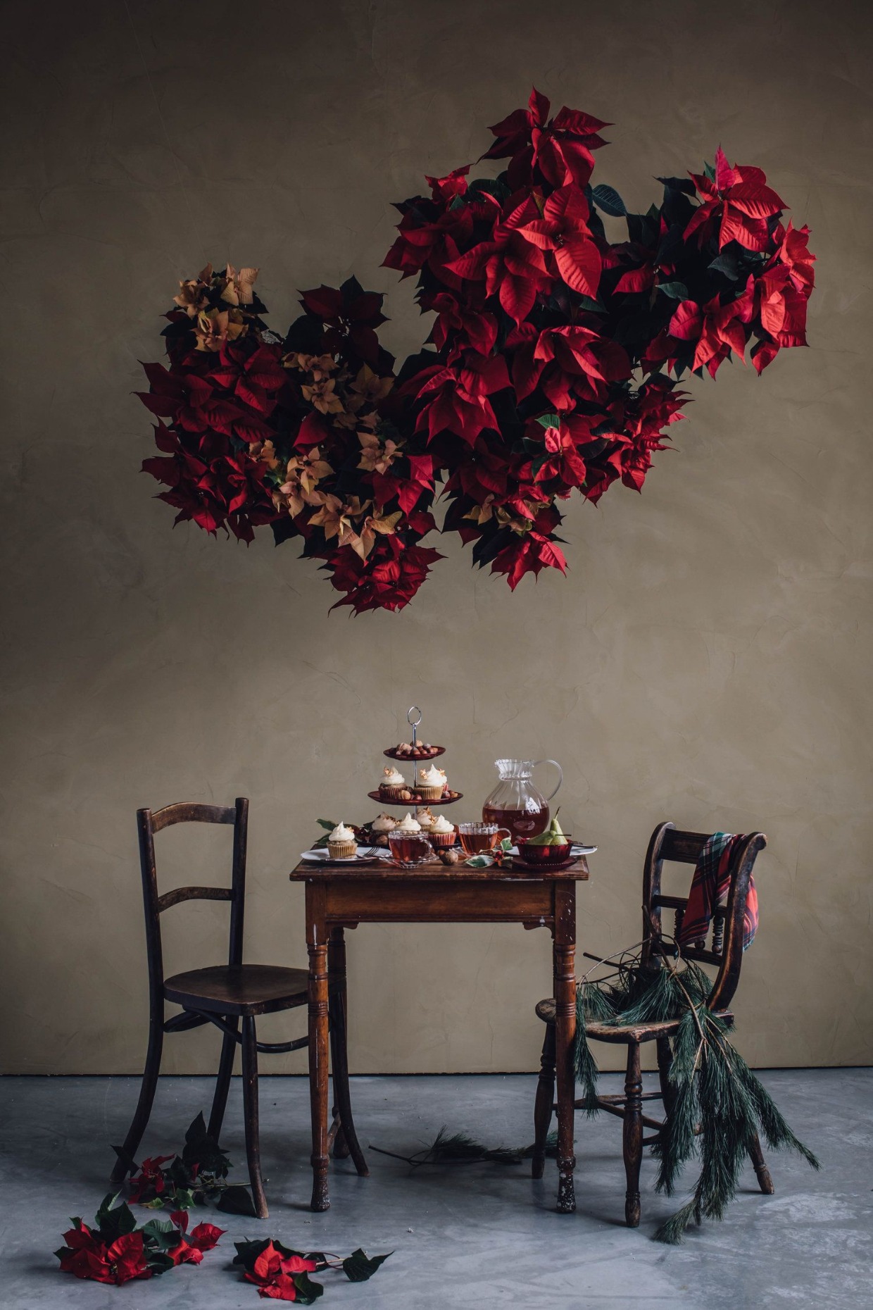 hanging poinsettia floral installation for holiday wedding