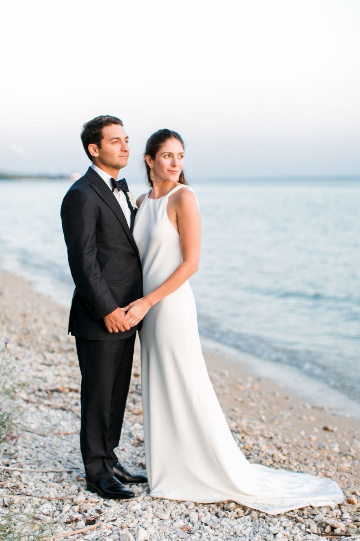 Elegant bride and groom at oceanside wedding ceremony