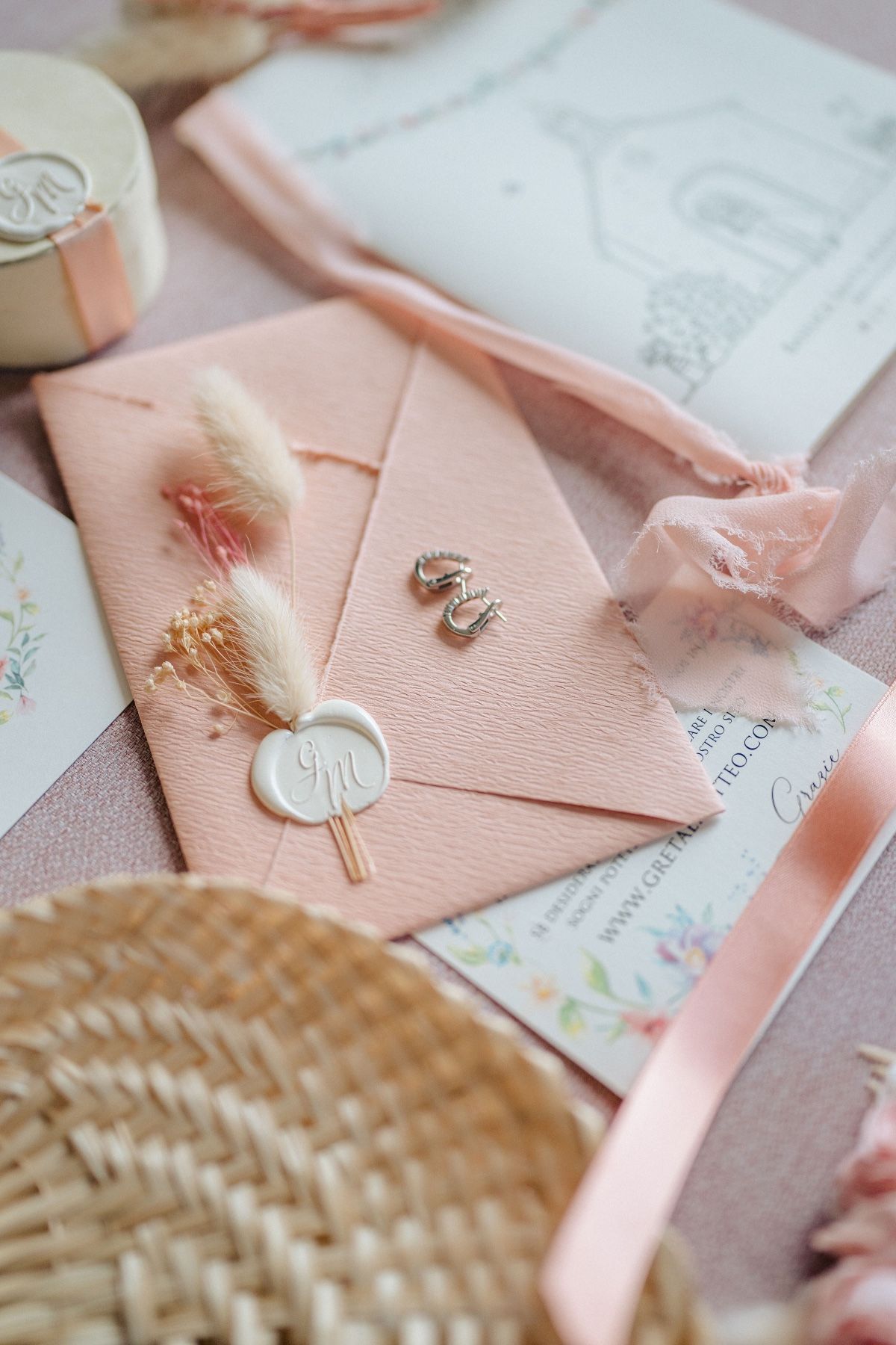 pink wedding invitation suite with ivory wax seal and dried flowers