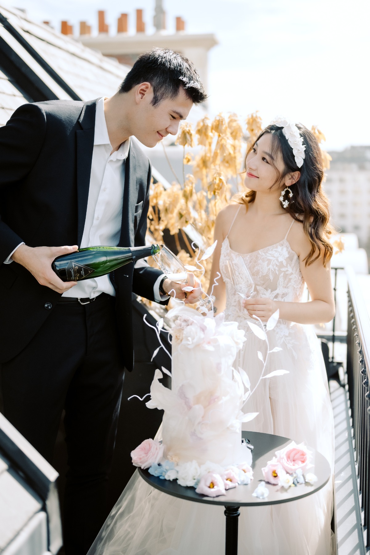 bride and groom toast on Paris balcony