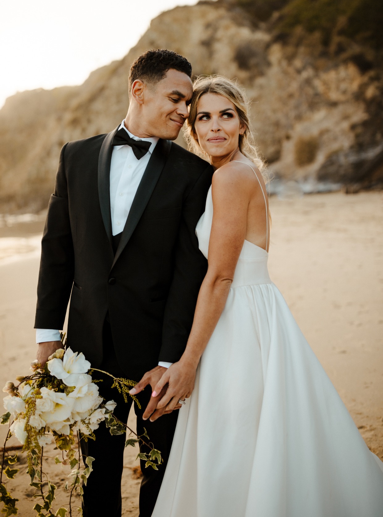 Bride and groom on a beach Stitch & Tie