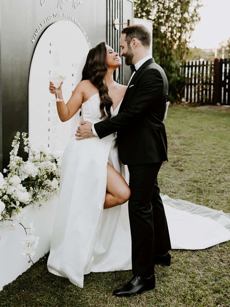 Picture-perfect black tie wedding with a Margarita wall