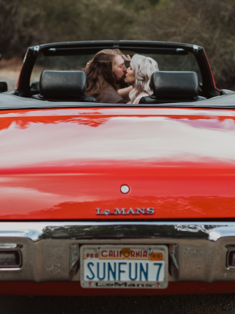 A boho backyard wedding with a vintage Pontiac LeMans Convertible