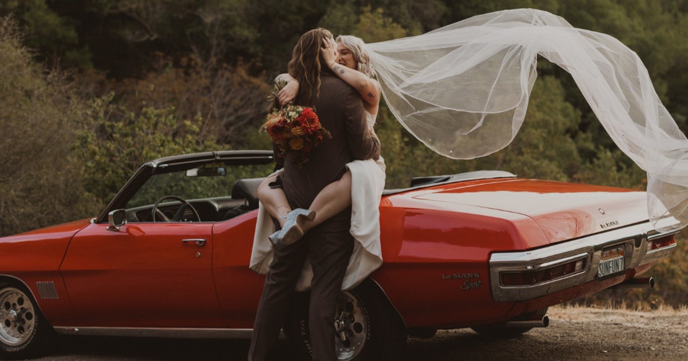 A boho backyard wedding with a vintage Pontiac LeMans Convertible