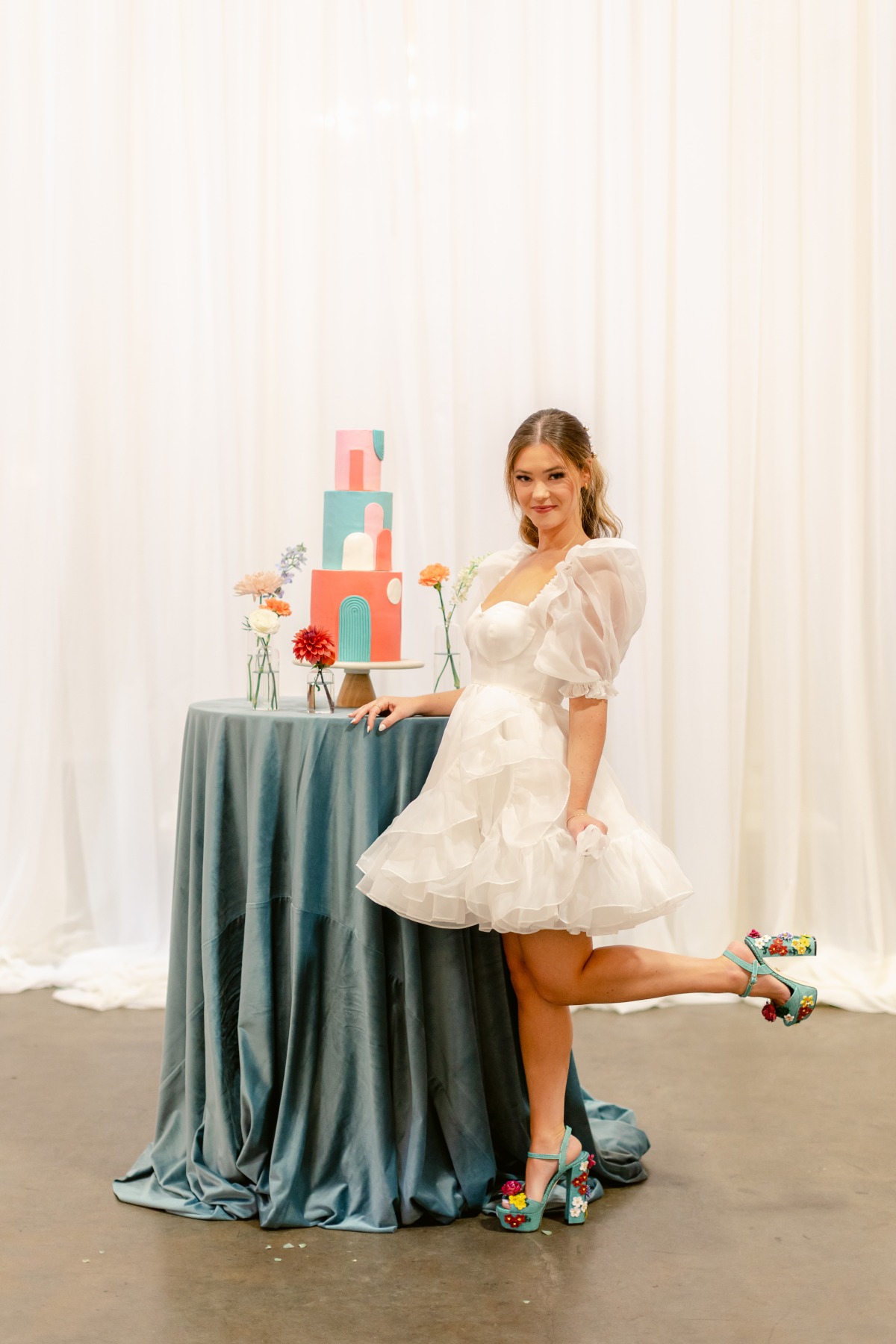 Bride with colorful wedding cake