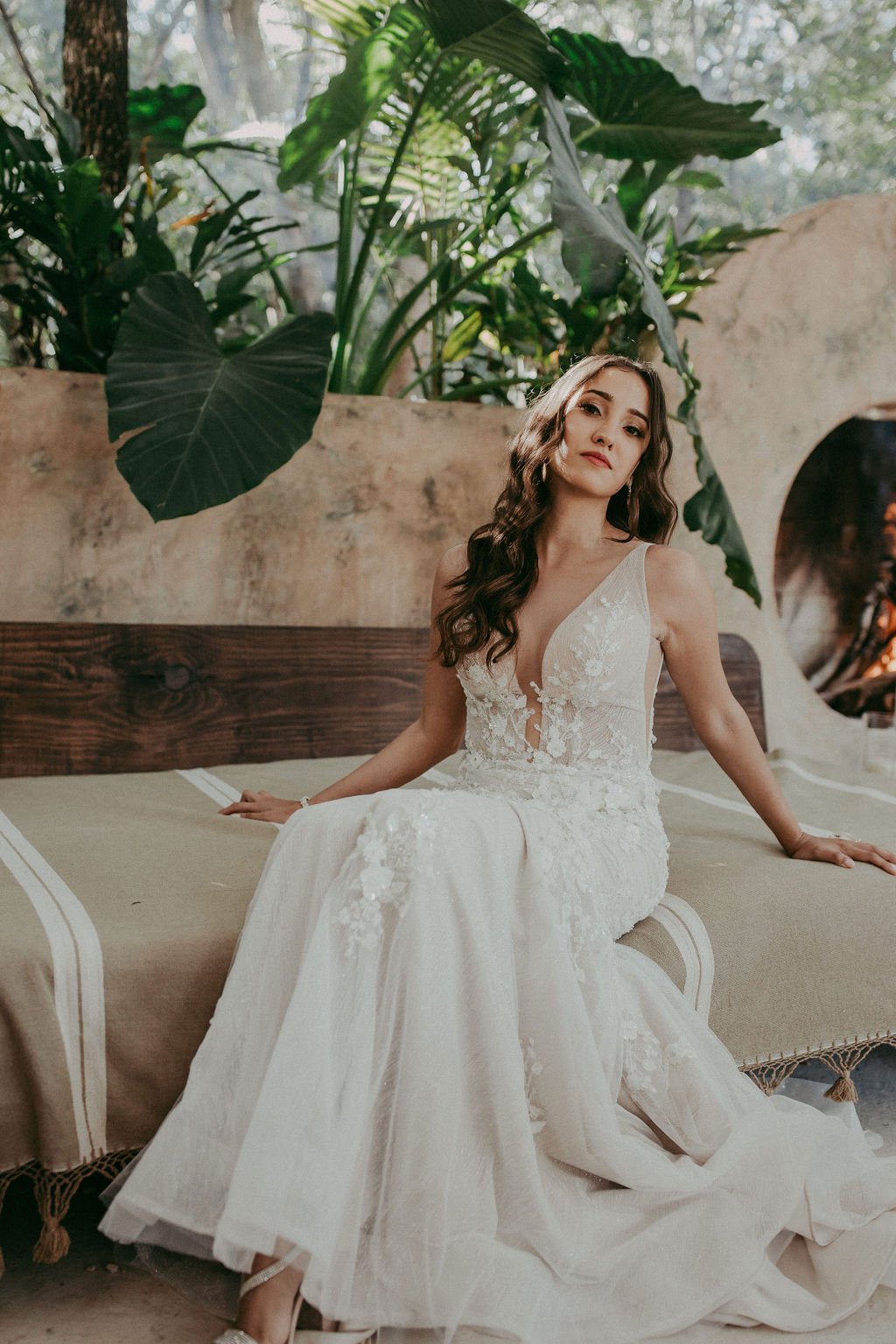 bride in lace and organza mermaid gown with plunging neckline