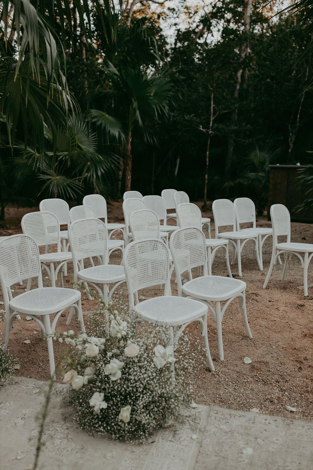 white cane chairs for ceremony