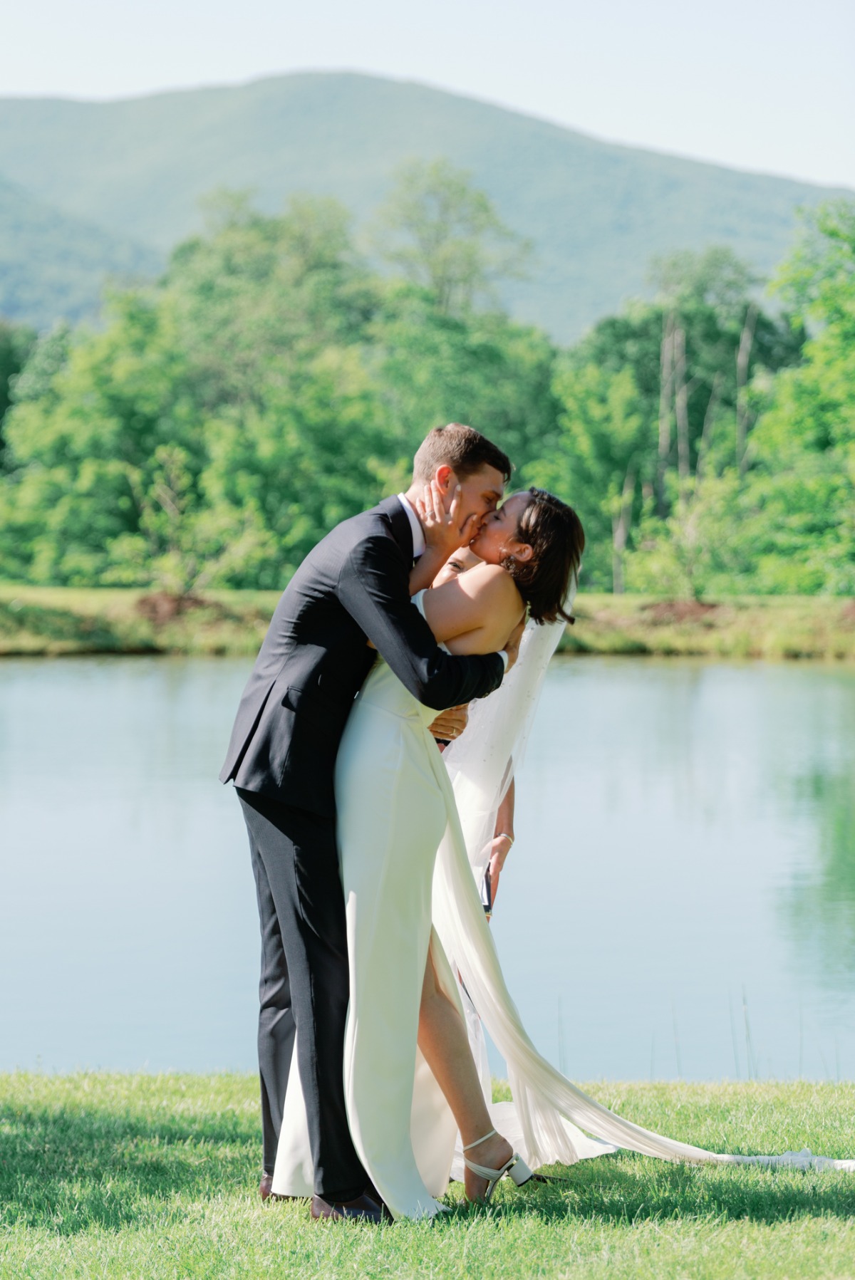 First kiss at outdoor Vermont wedding