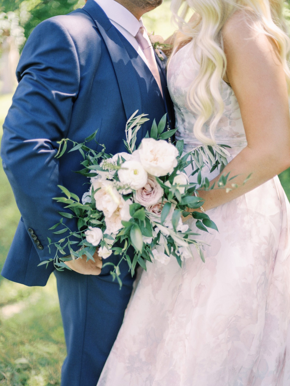 blush floral wedding dress and blue wedding suit