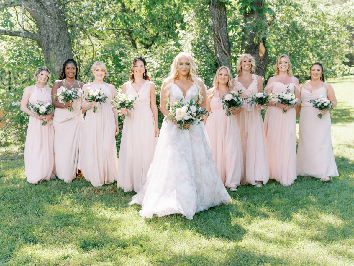 bride with her bridesmaids in mix and match blush chiffon dresses