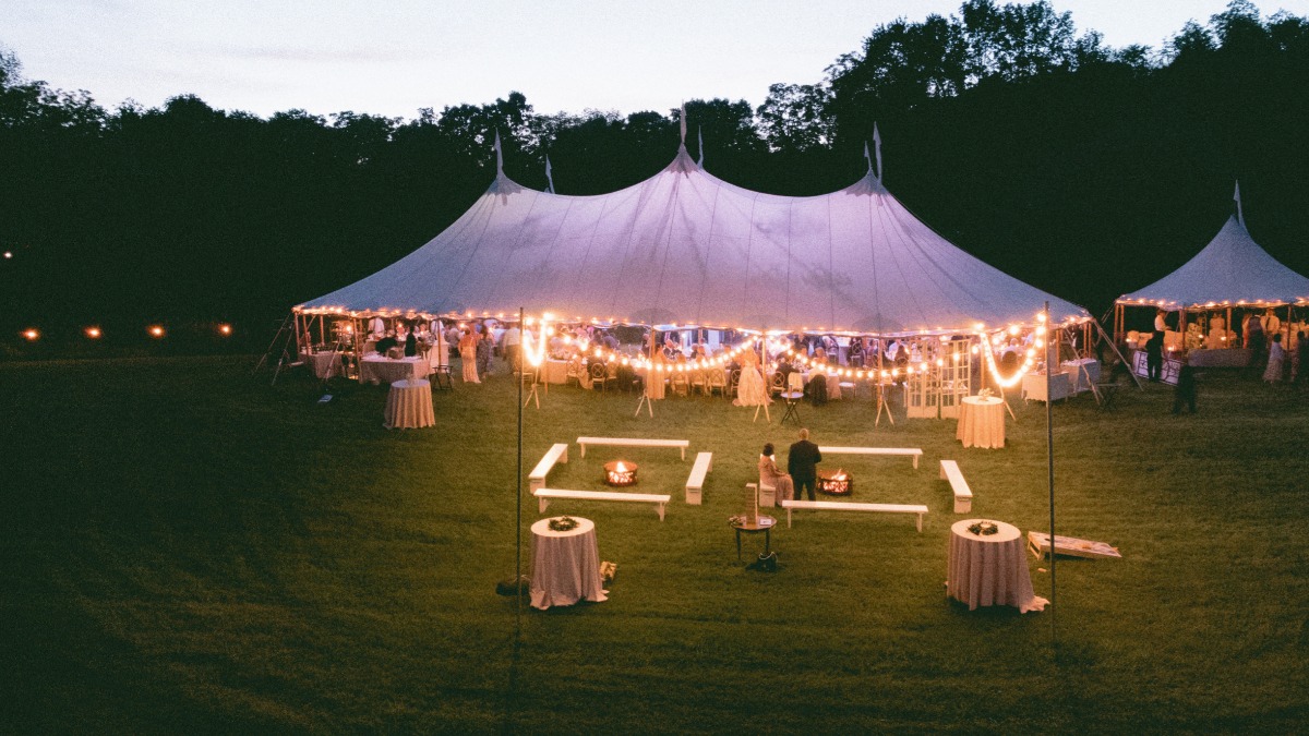 tented wedding reception at night