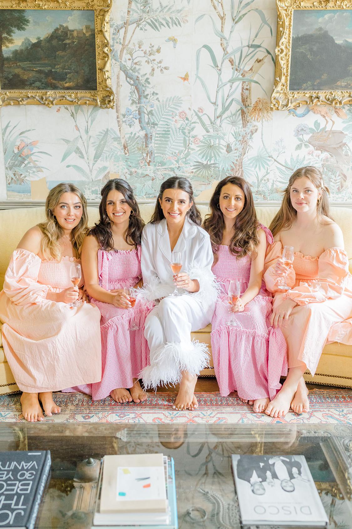 bridesmaids getting ready in sherbet colored nap dresses