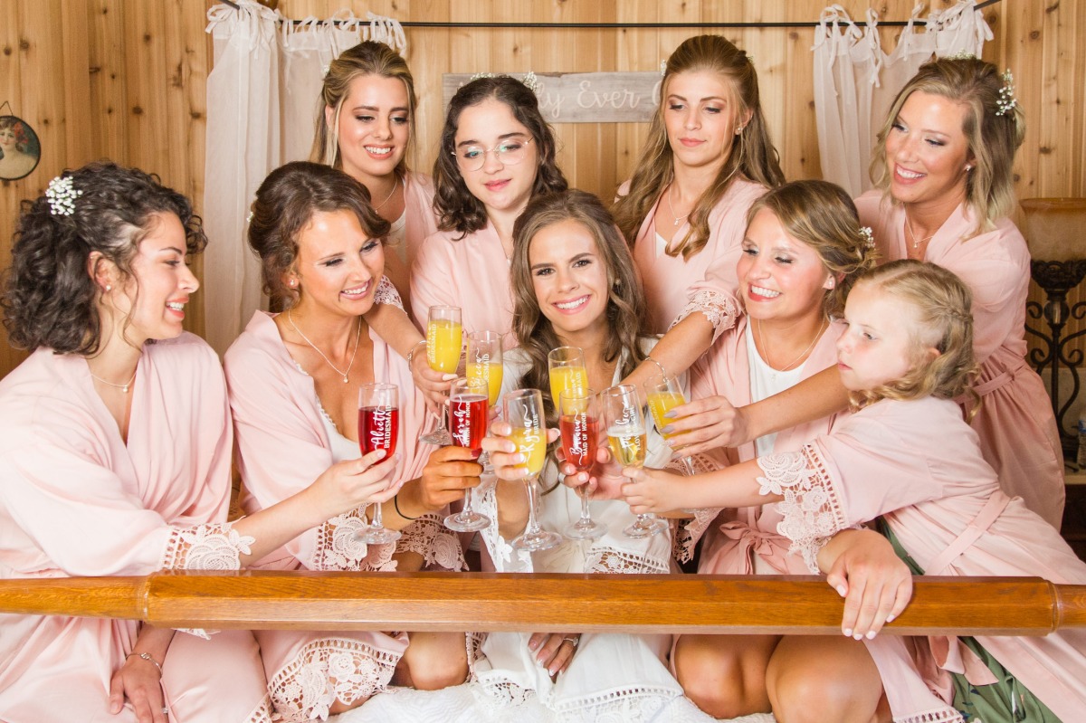 Bridal party toasting mimosas