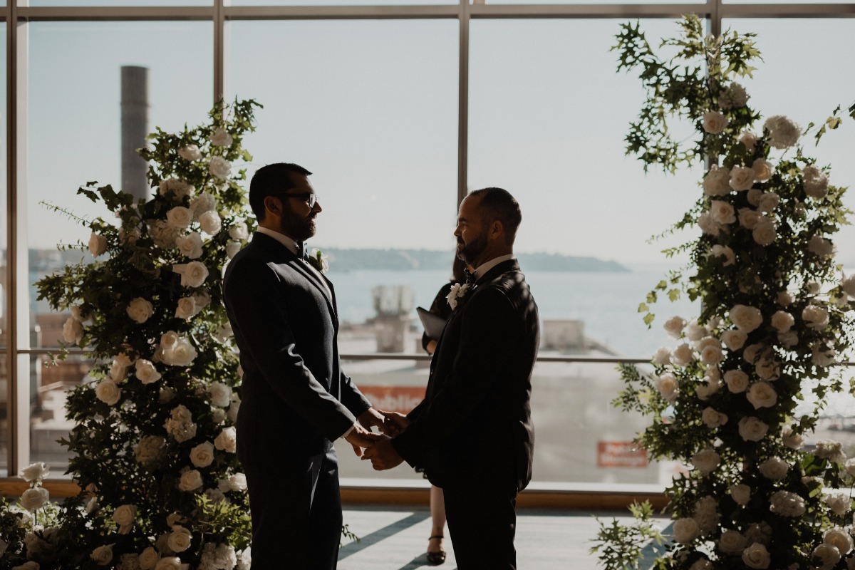 Moody floral same sex wedding ceremony