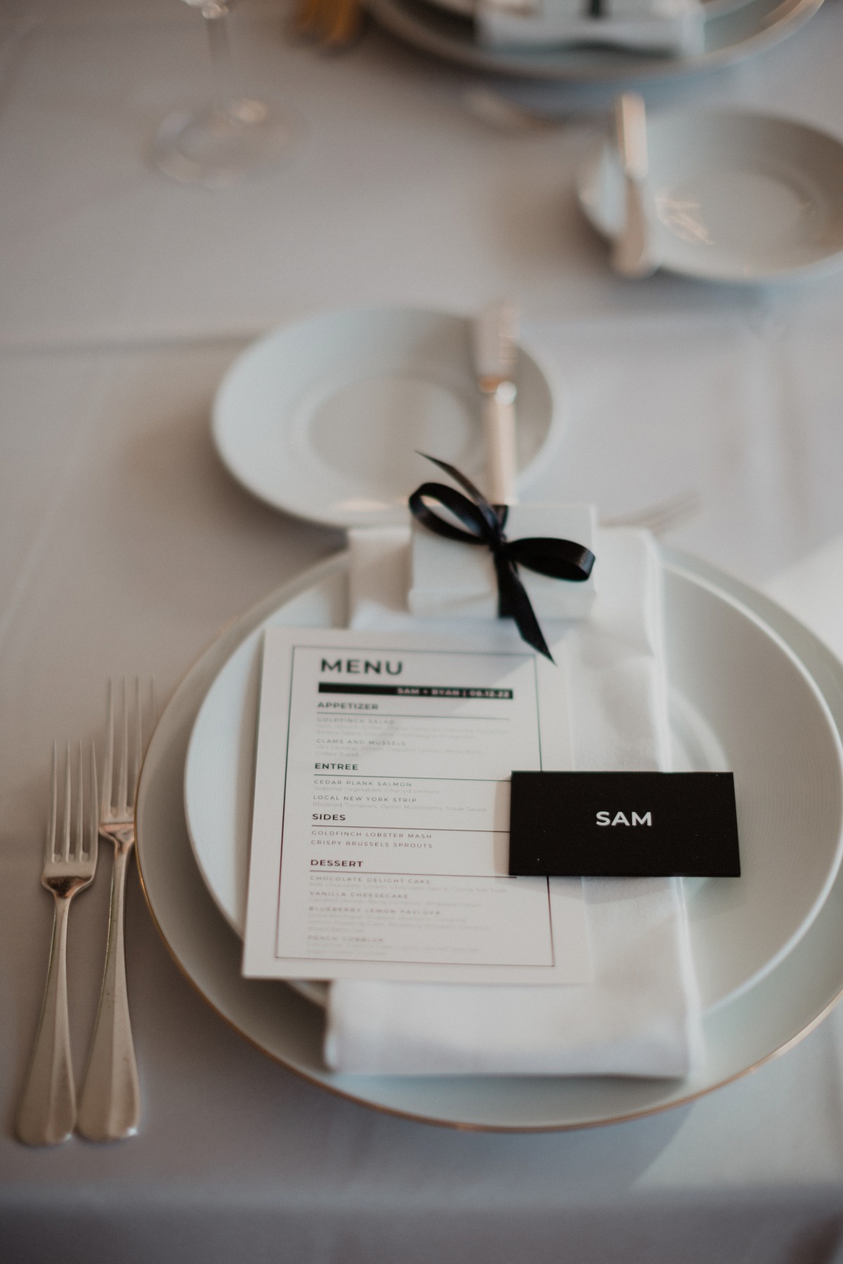 Monochrome dinner menu and place setting 