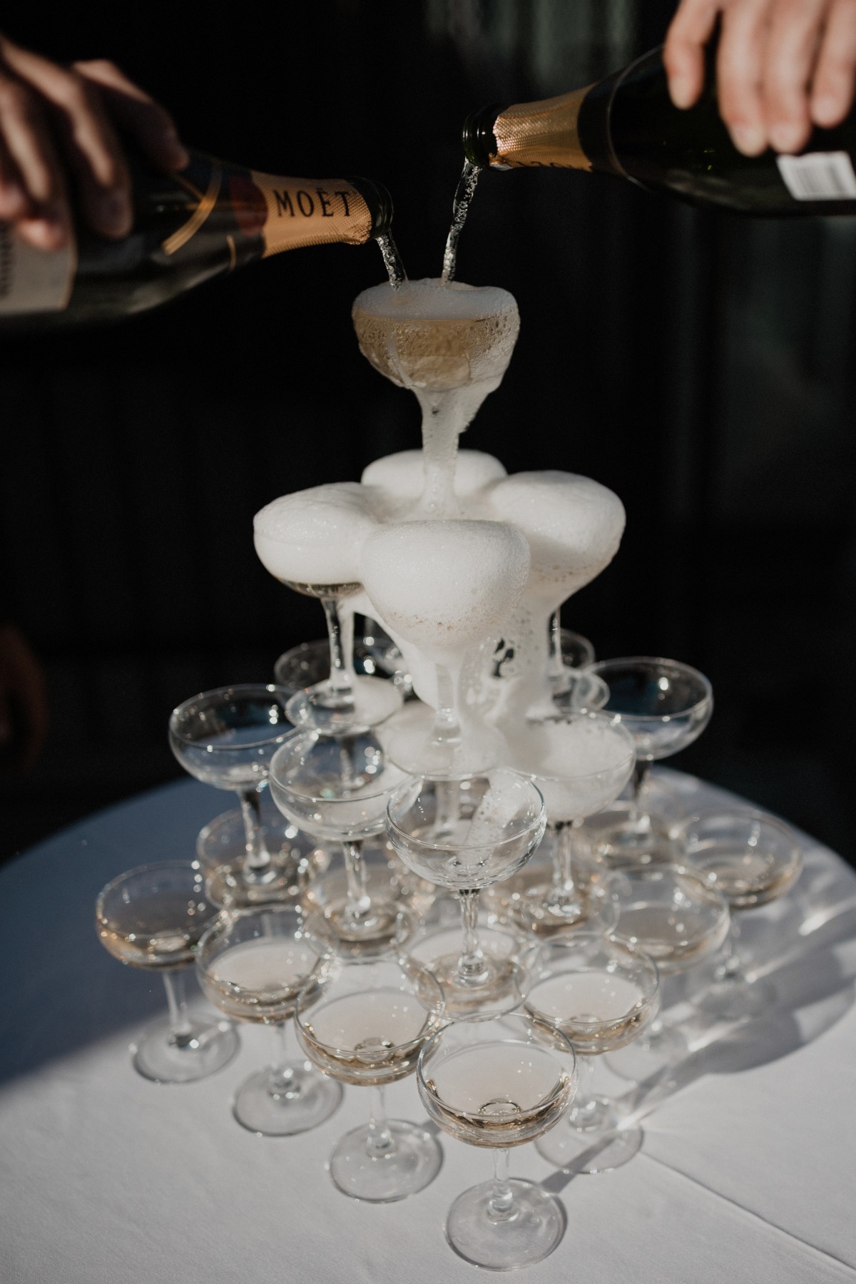 Groom champagne tower pour