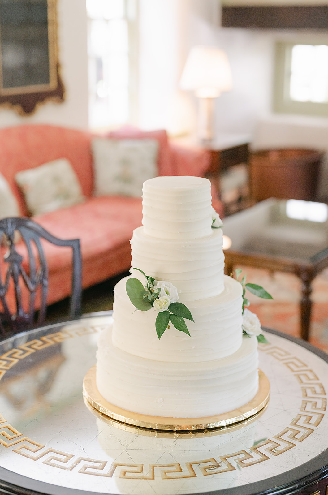 simple butter cream cake with live florals