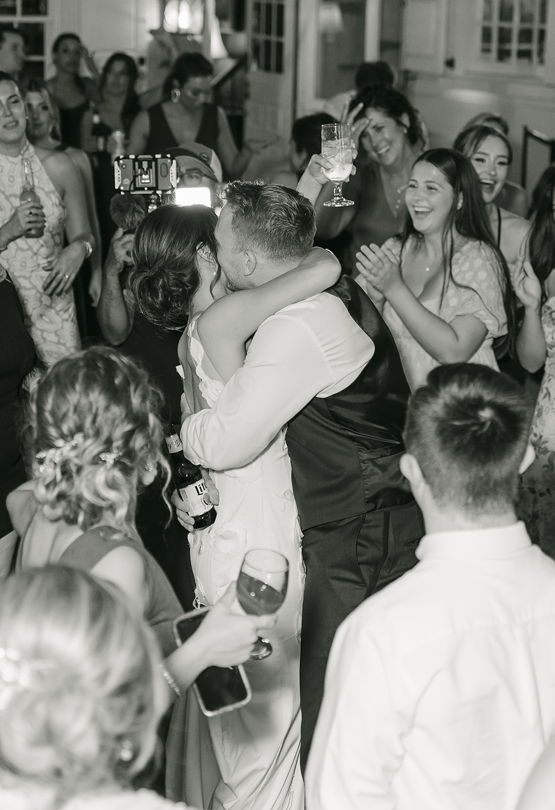 first dance at tented reception with black and white photography