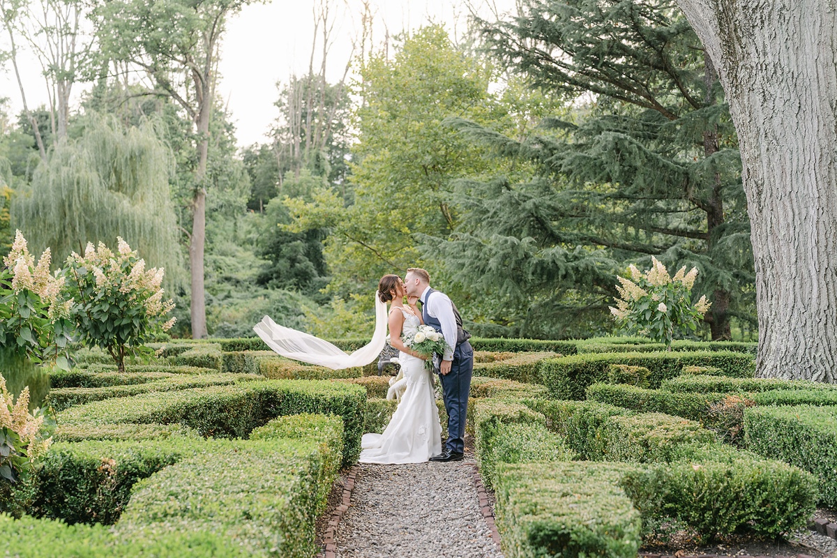 garden wedding inspiration with veil blowing in the wind