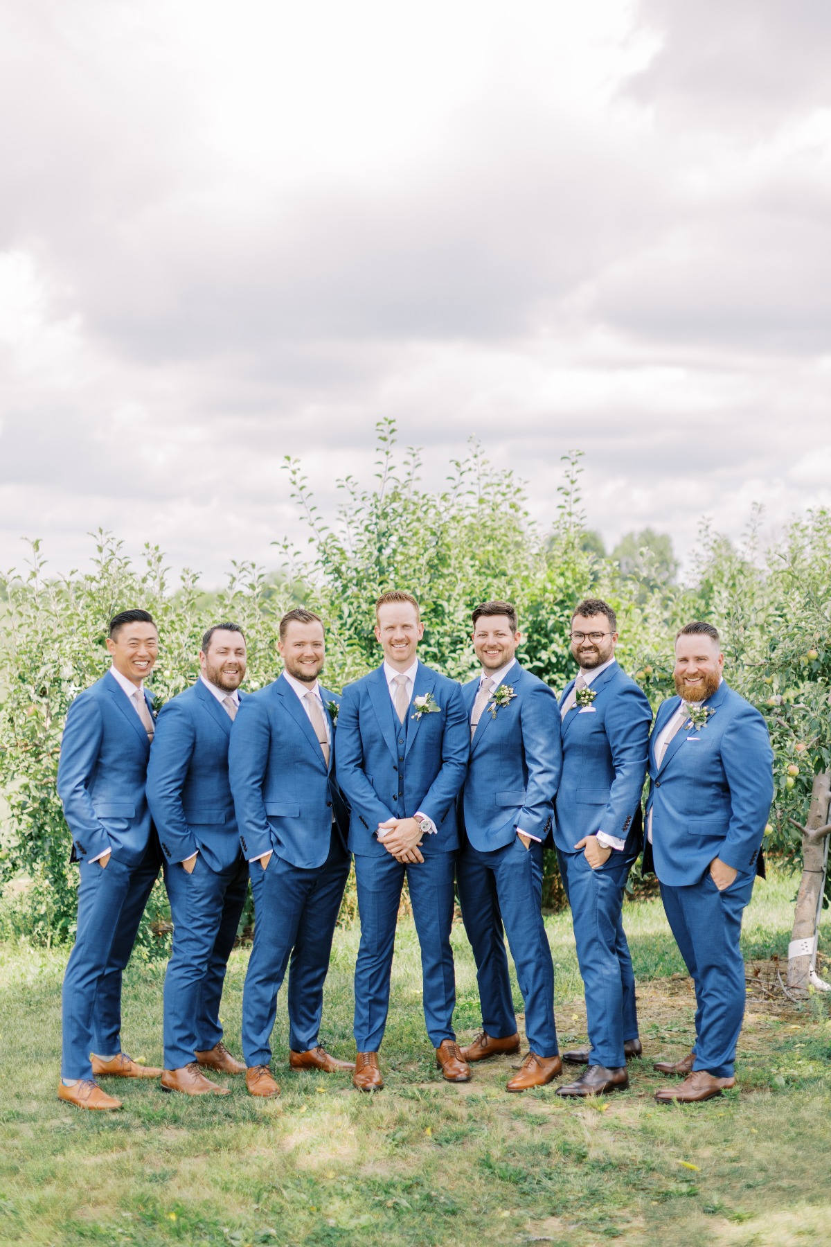 groom and his men in blue suits