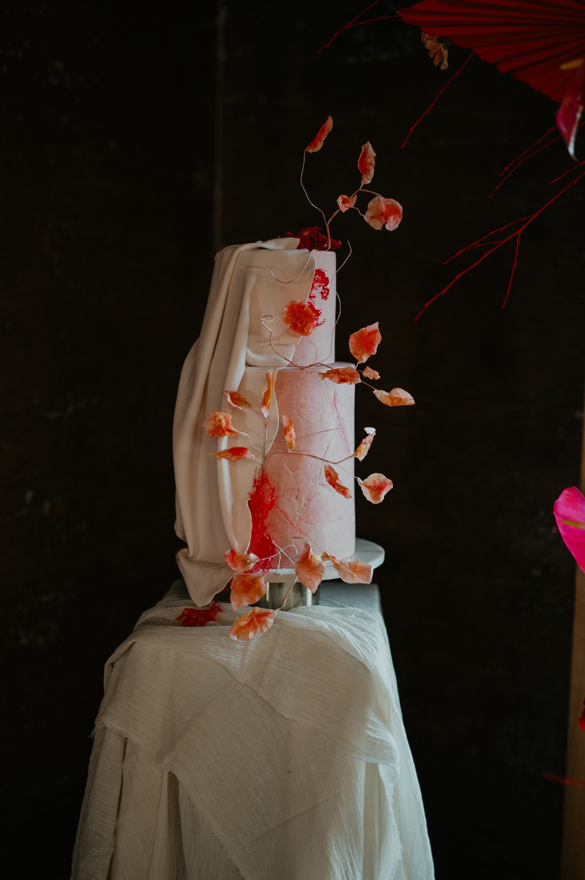 coral draped wedding cake