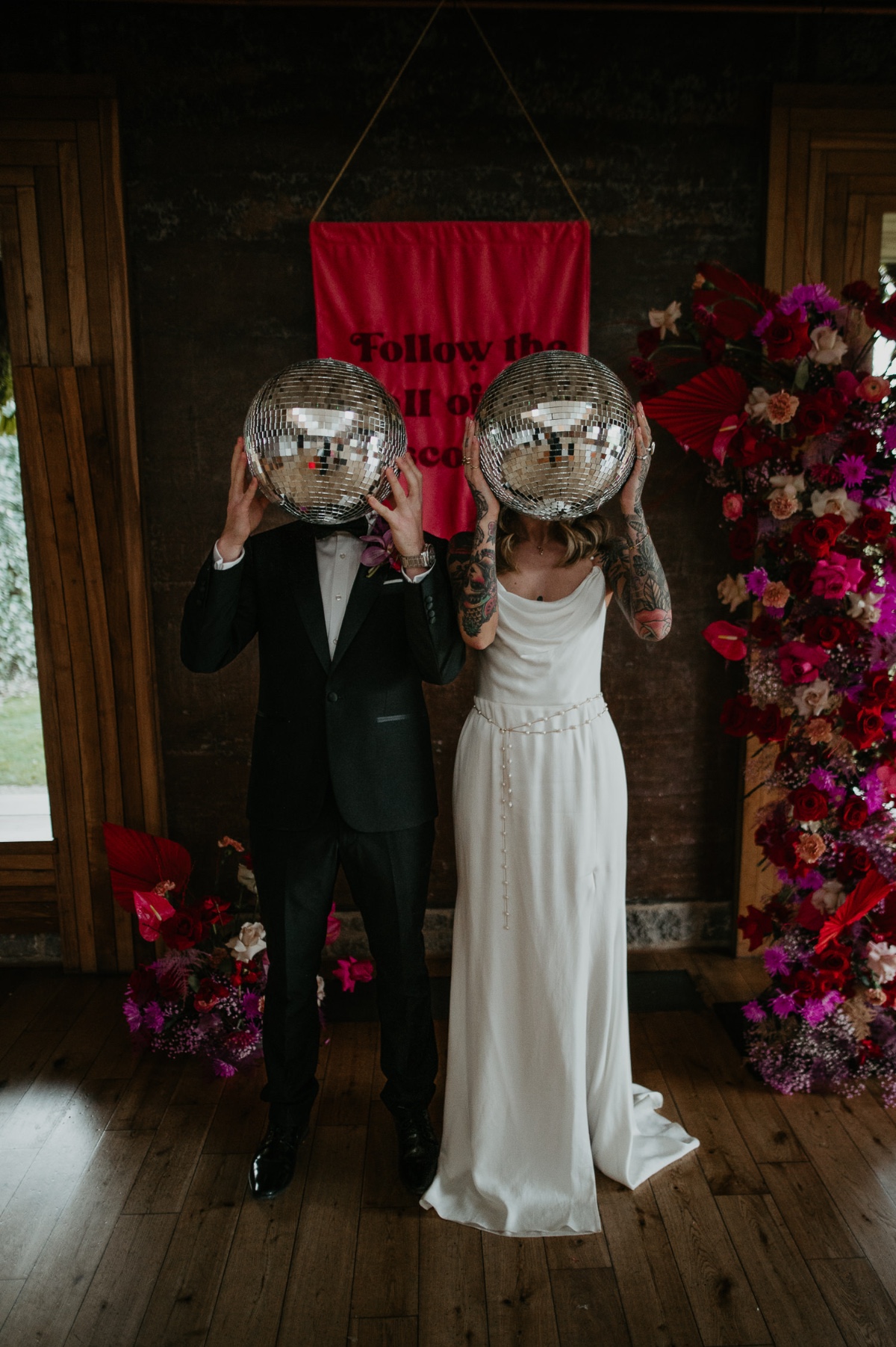bride and groom at disco themed reception
