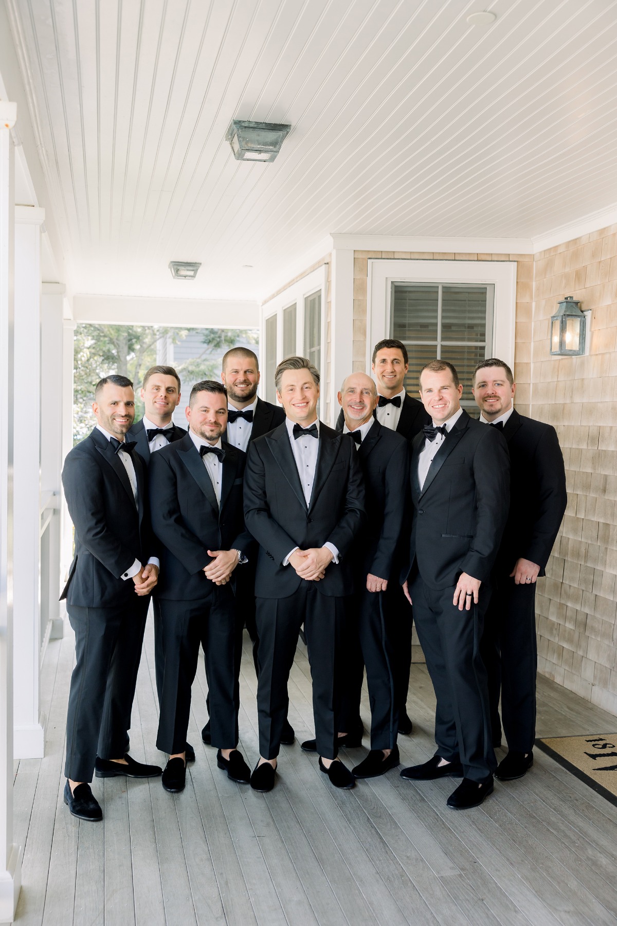 black suits with bow ties