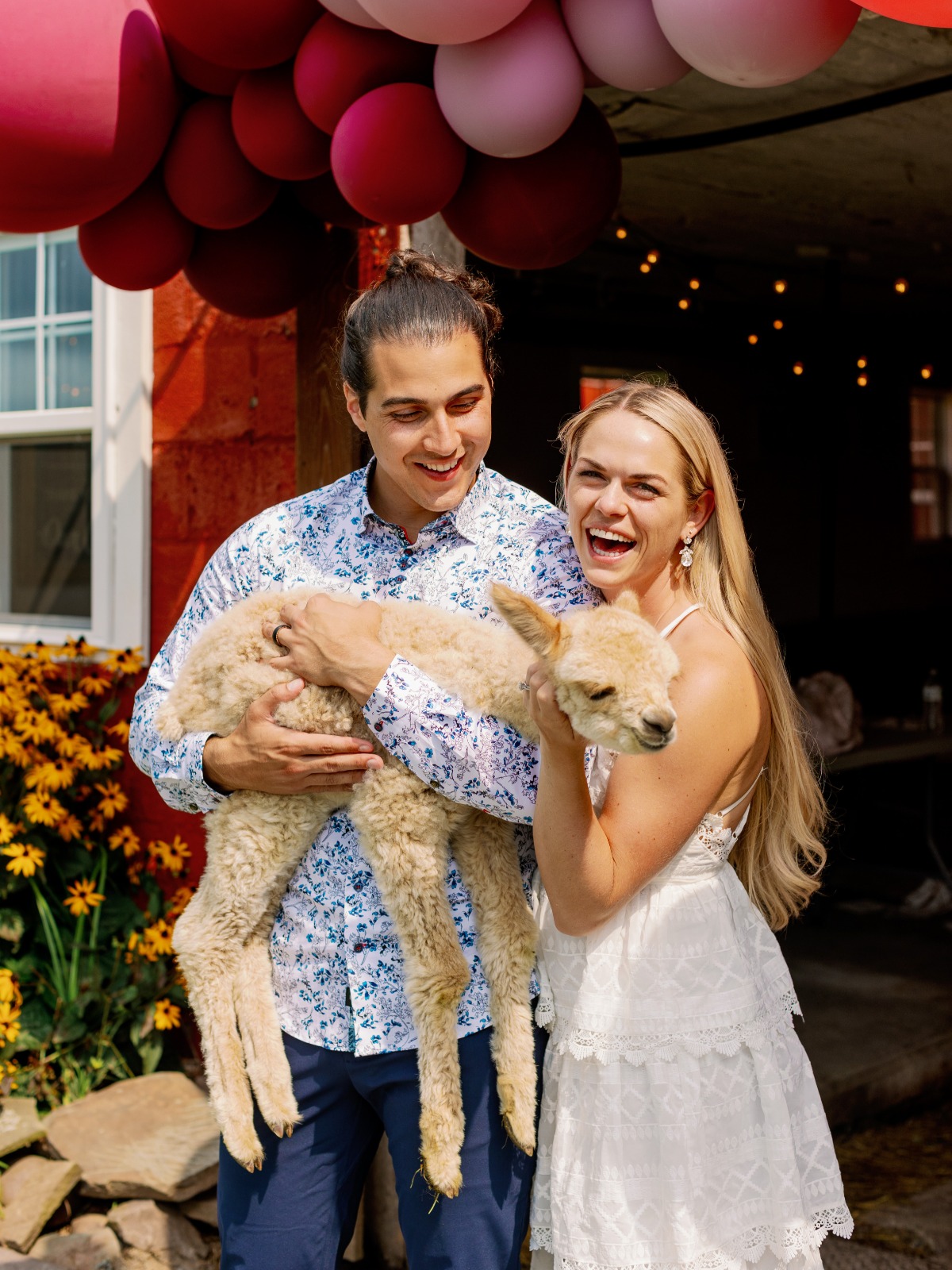 Newlyweds with baby goat