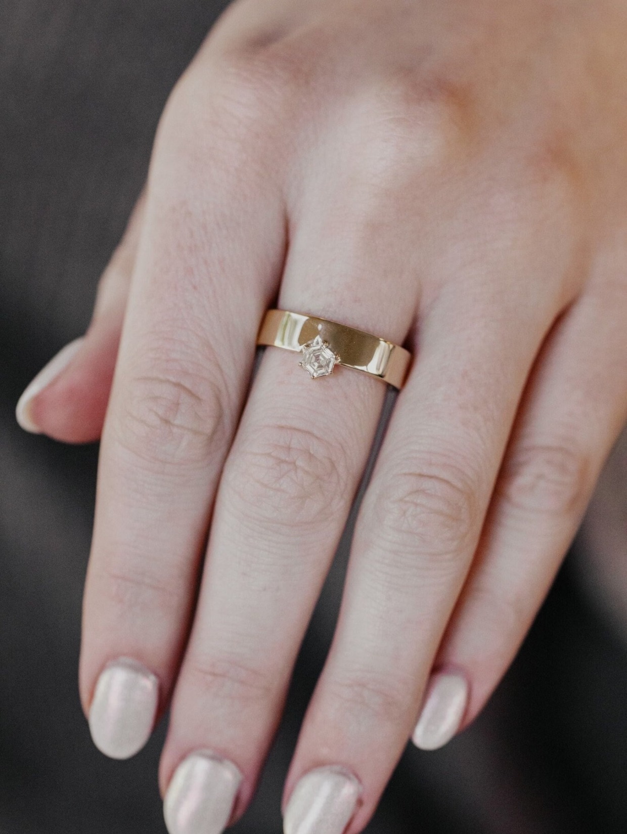 yellow gold cigar band with hex cut diamond
