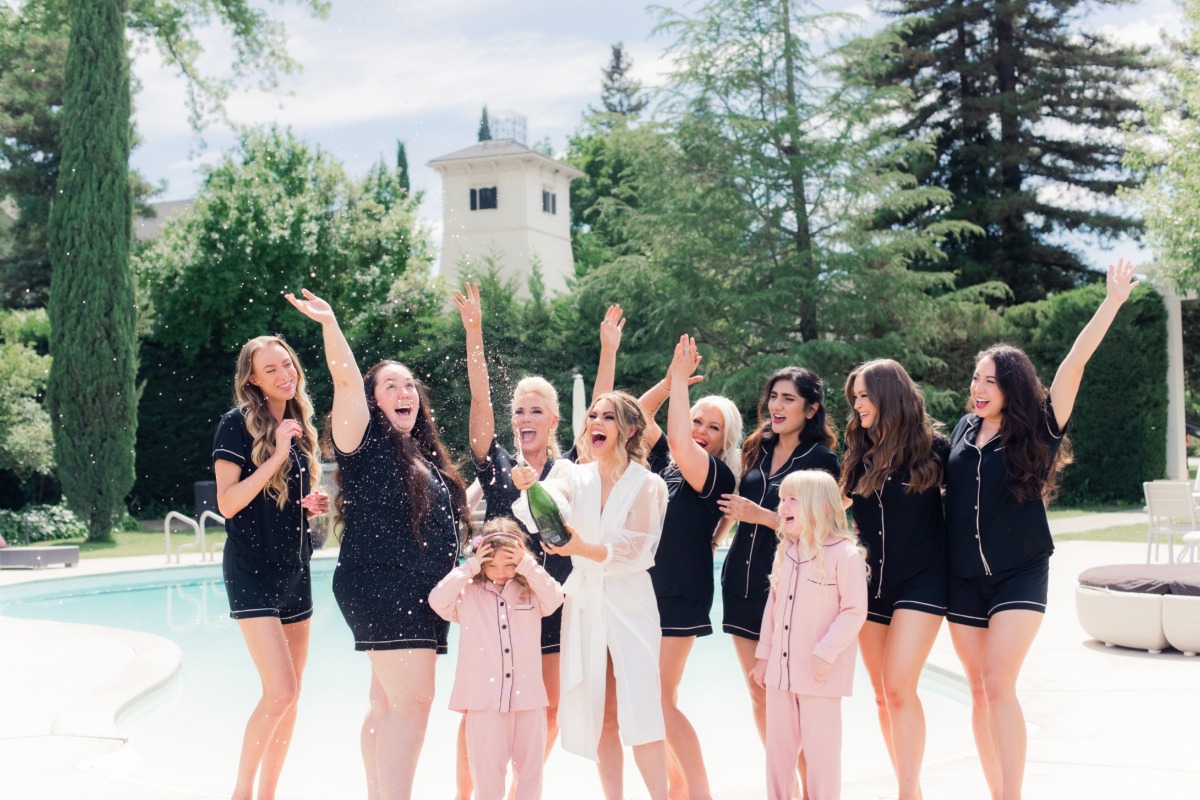 Bridemaids popping champagne at Park Winters