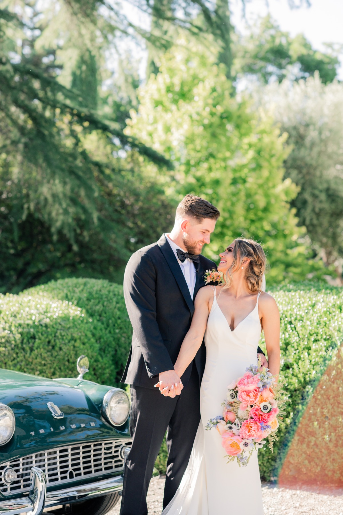California bride and groom with classic car
