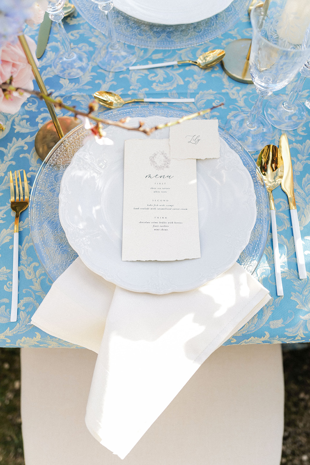 elegant table setting with gold flatware