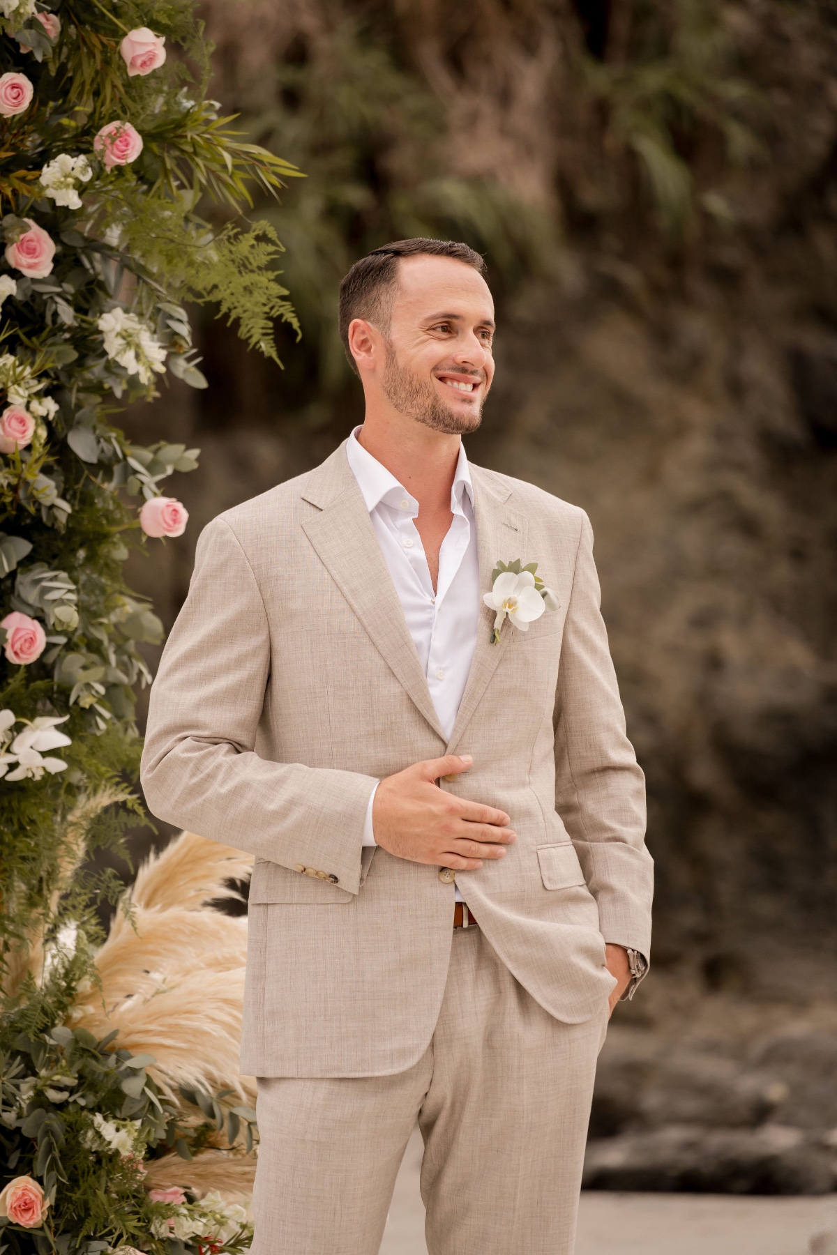 groom in linen suit for beach wedding