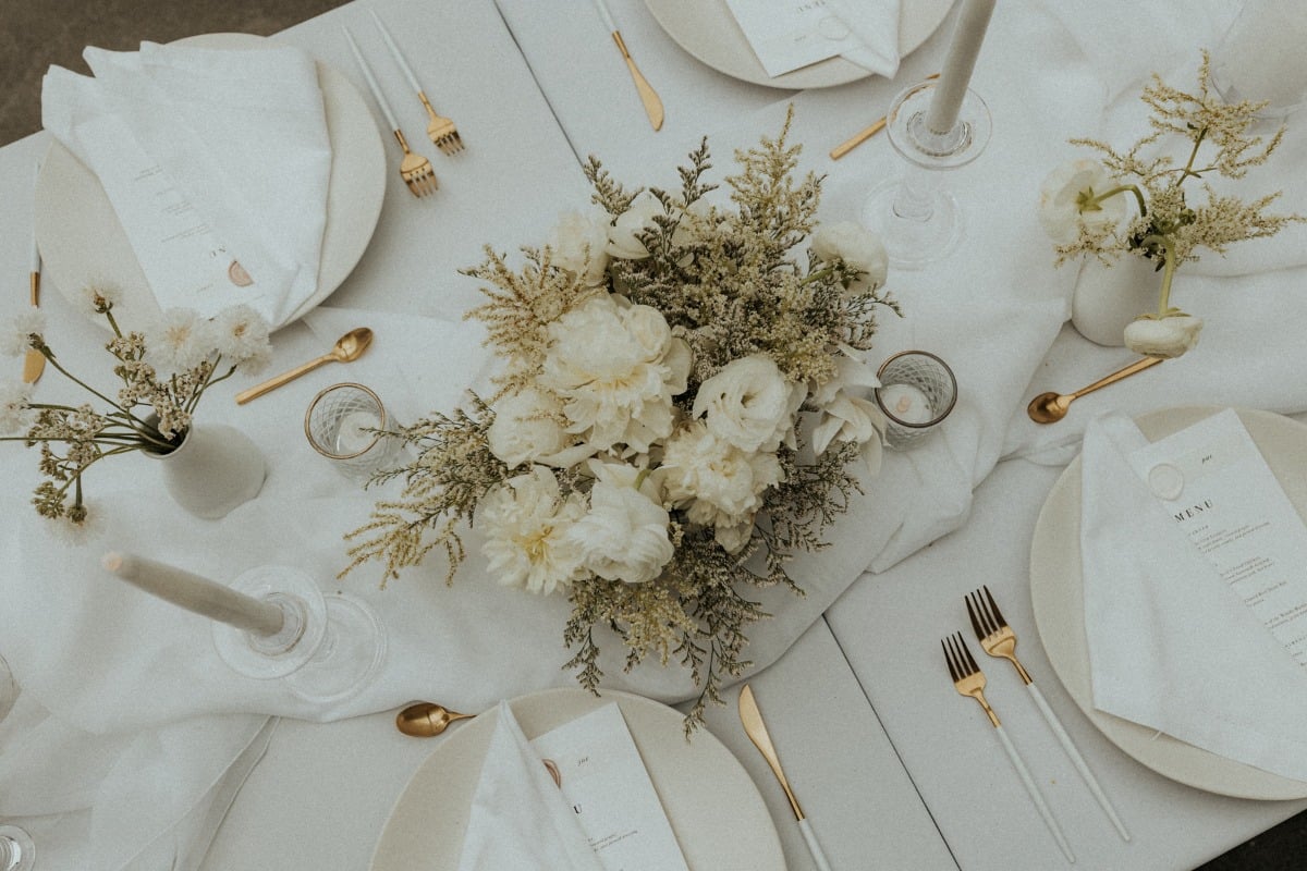 off-white wedding reception flower arrangement