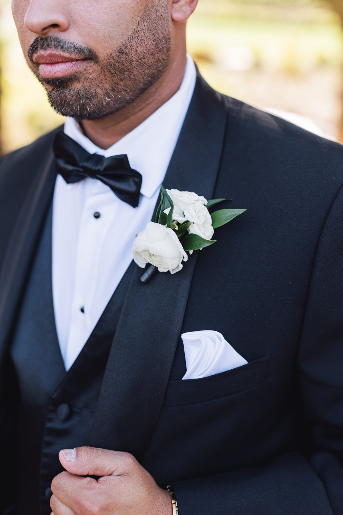 groom in three piece tux