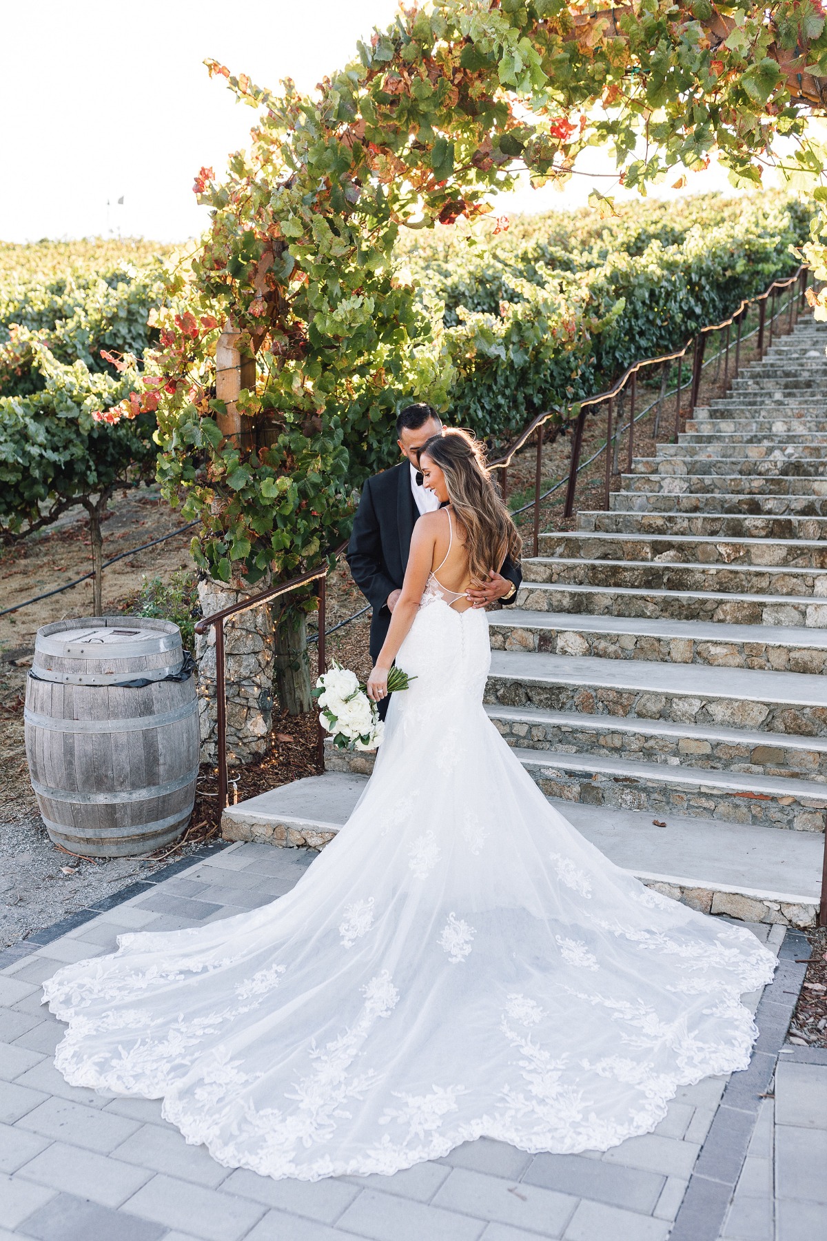 bride in white lace mermaid gown with dramatic train