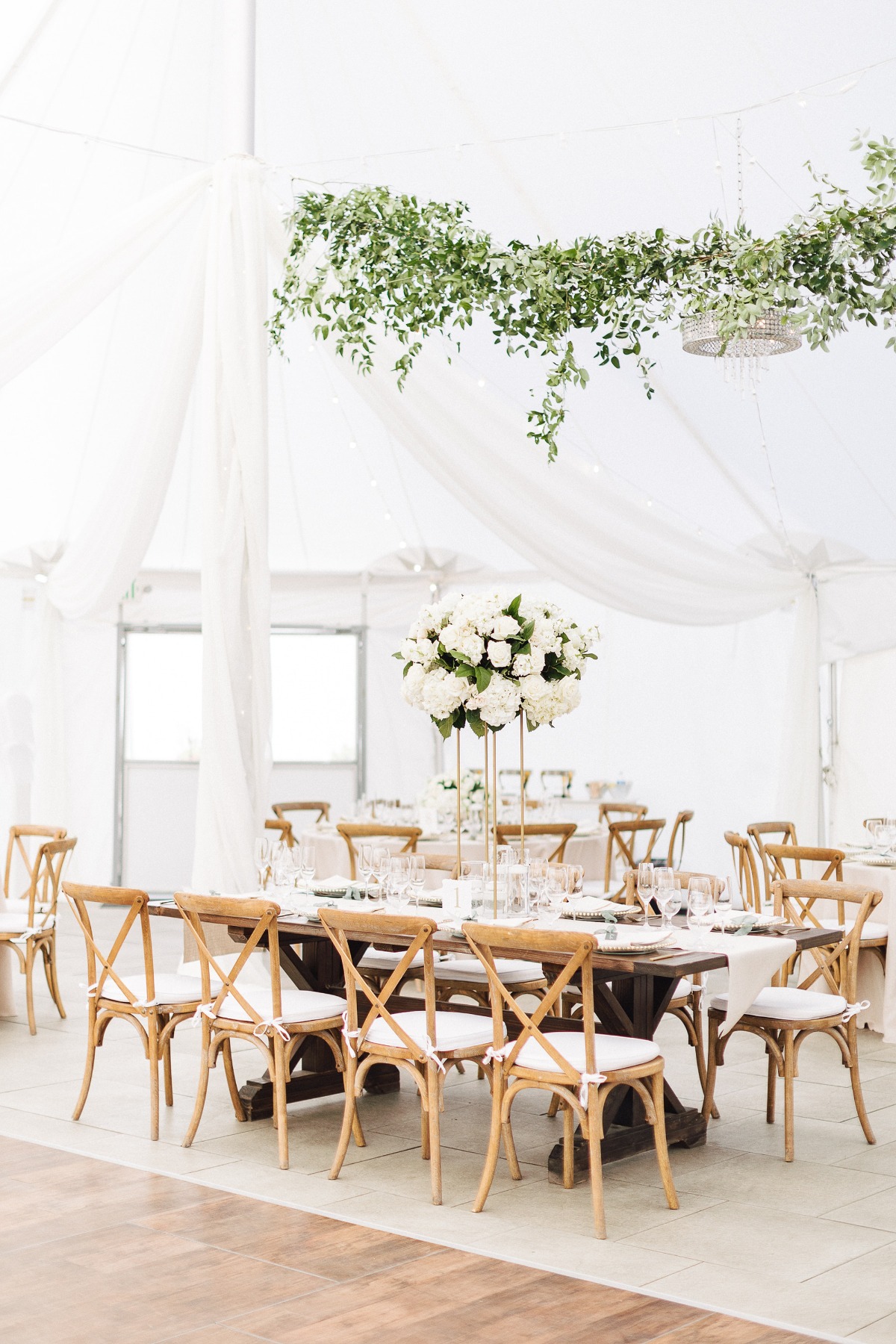 tent wedding with hanging vine floral installations