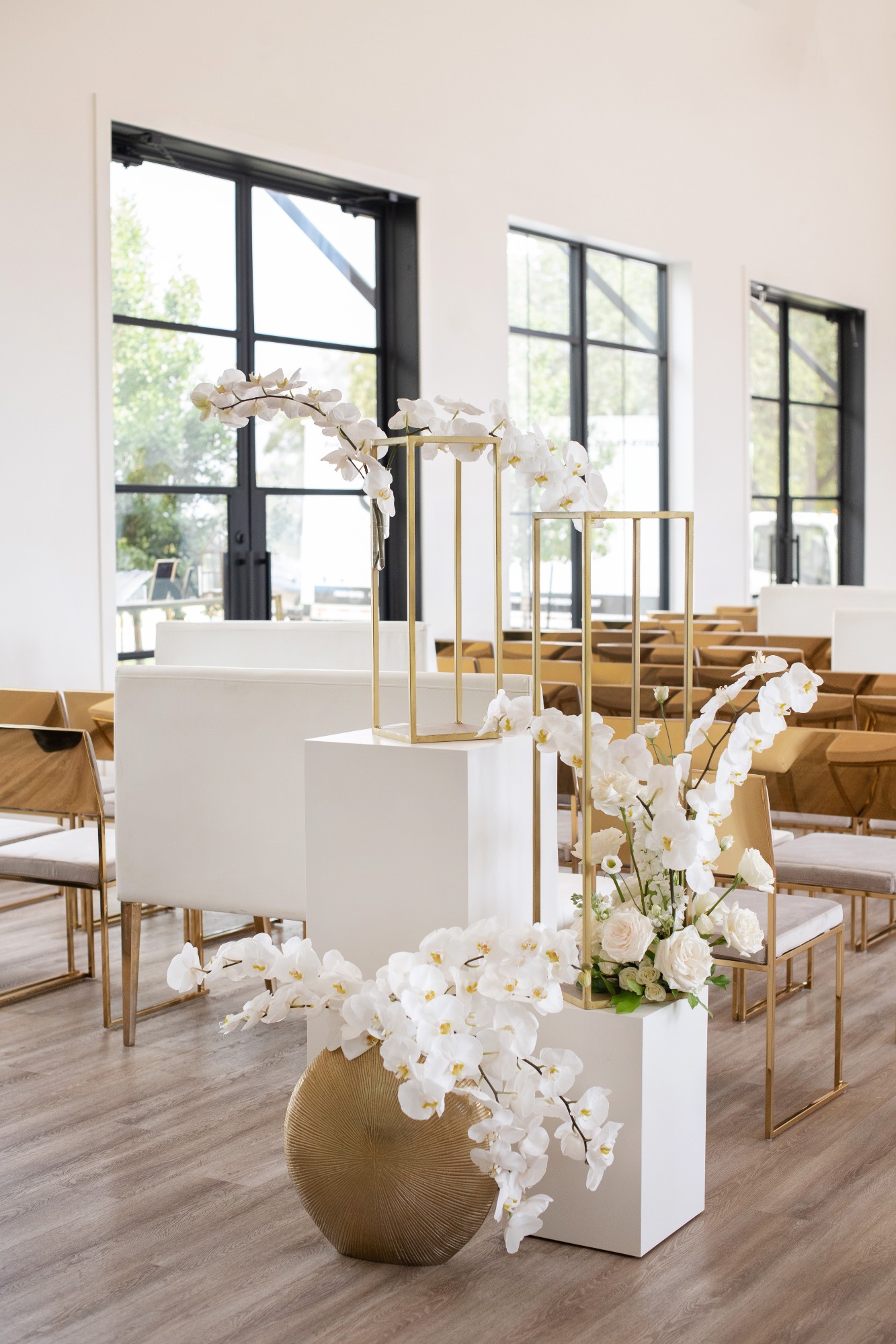 white orchid ceremony arrangements