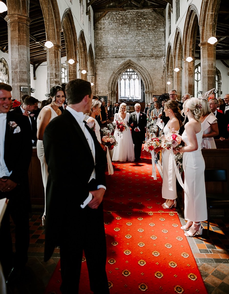 red carpet aisle for church wedding