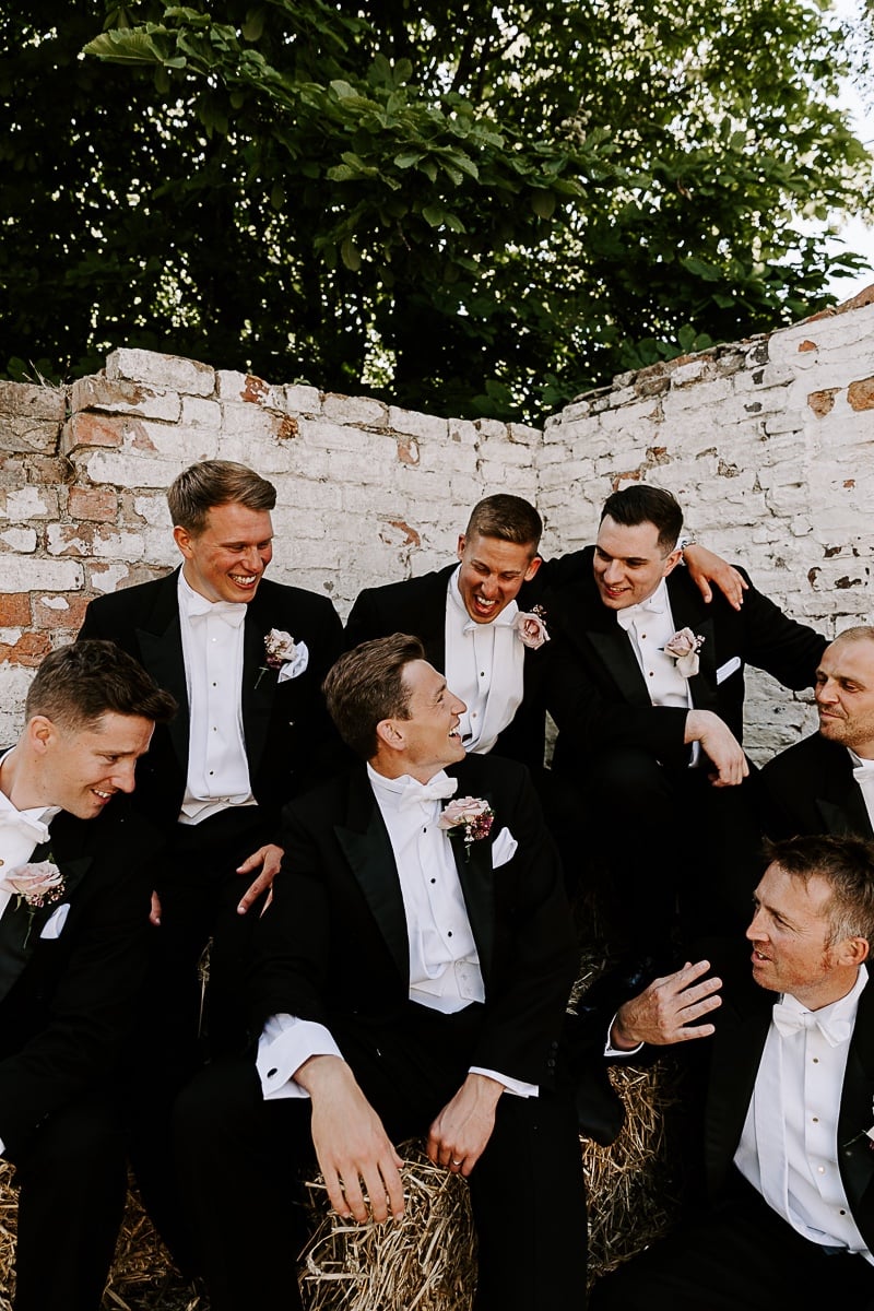 groom and groomsmen in white tie dress