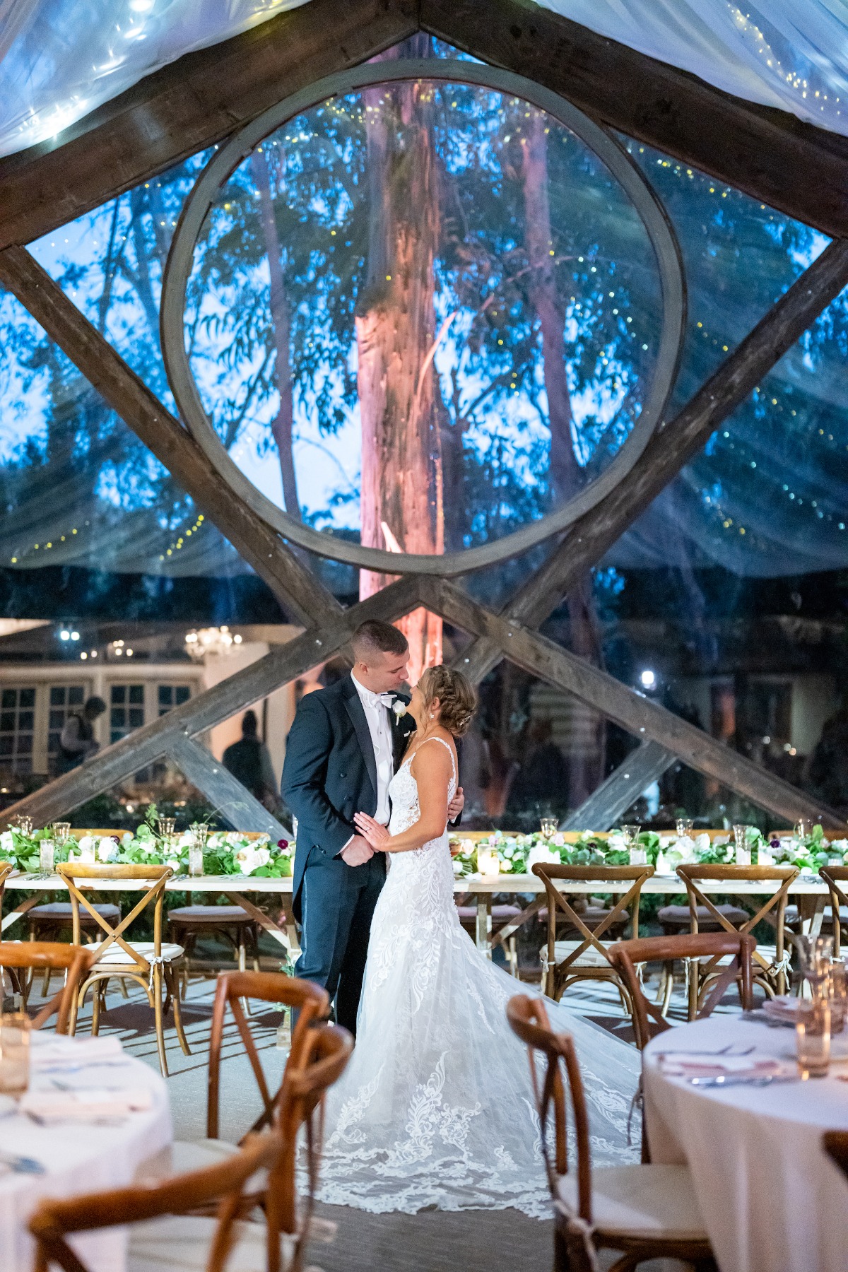 bride and groom share first dance in woodland wedding venue