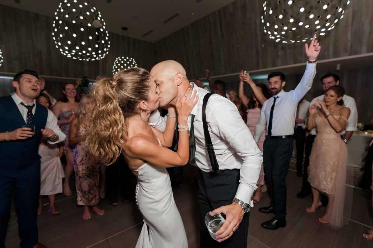 Newlyweds kiss on dance floor
