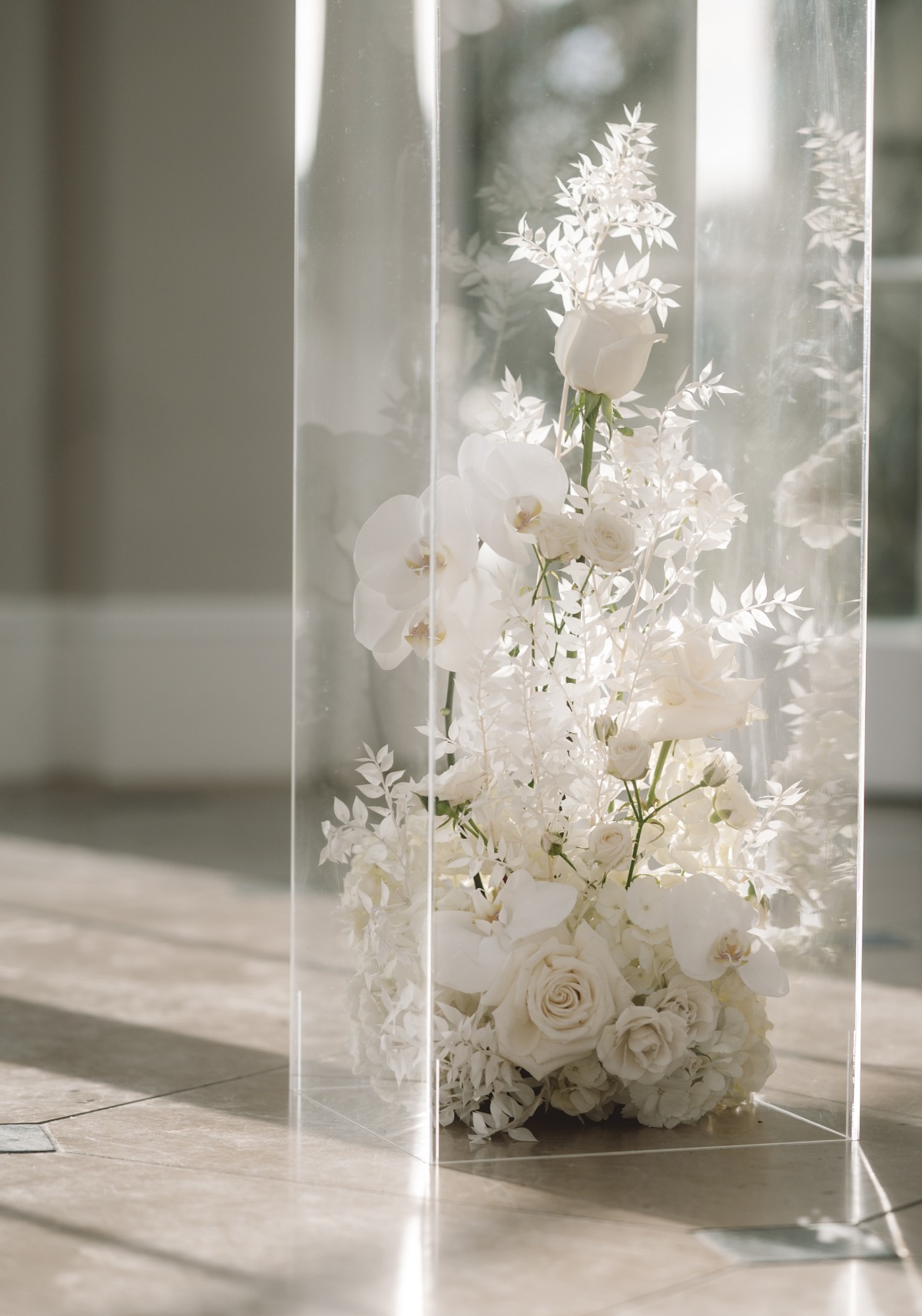 orchid and rose all white floral arrangement