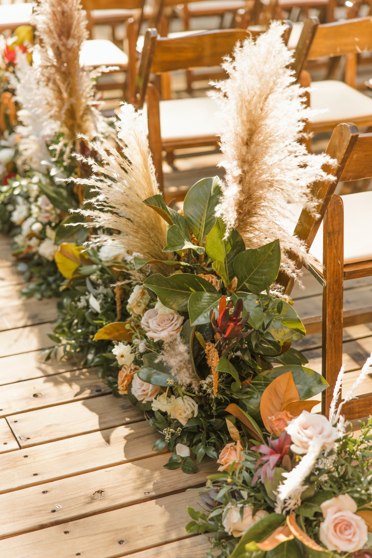 fall aisle wedding arrangements with pampas grass