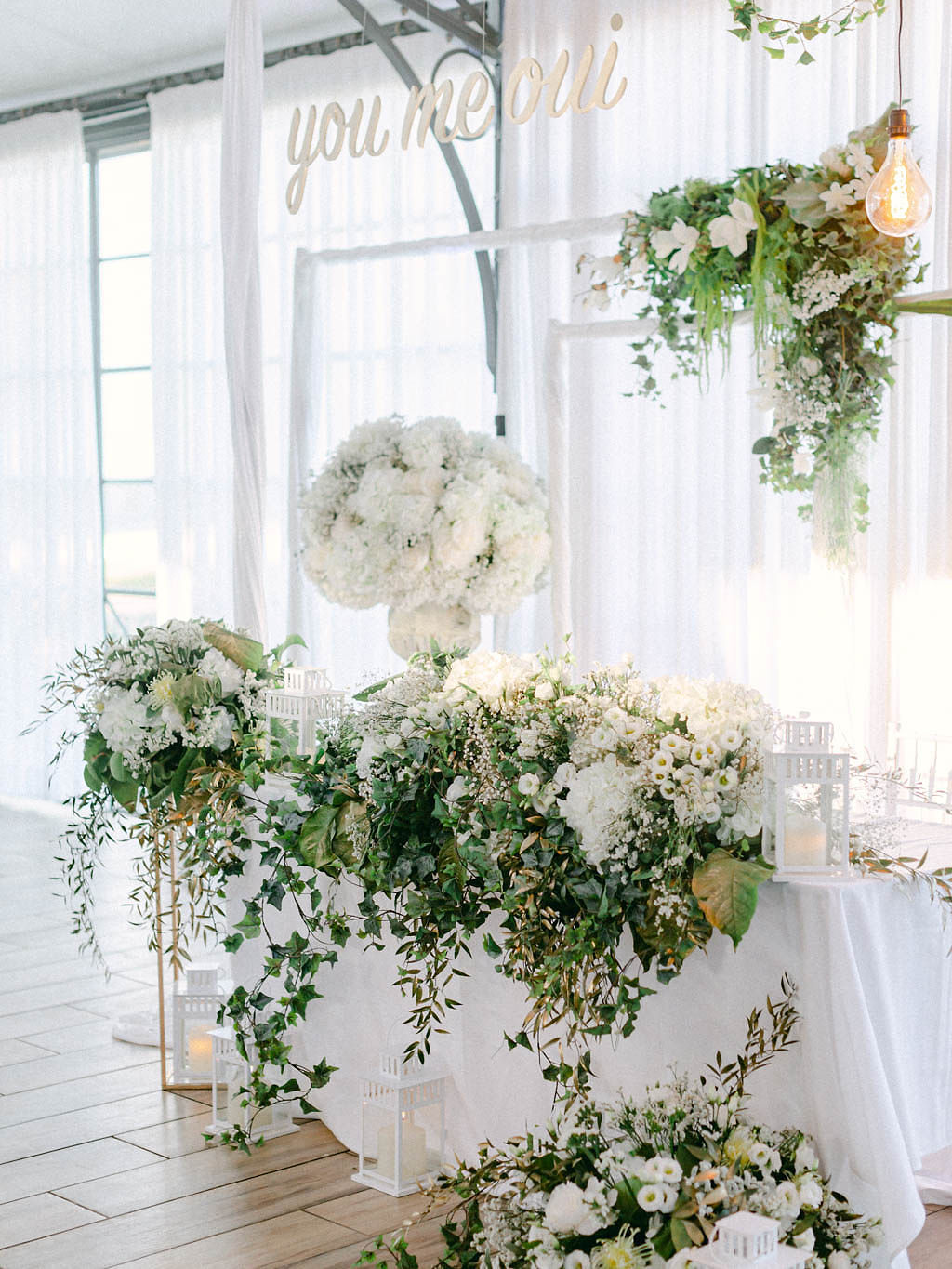 white flower and greenery reception installations