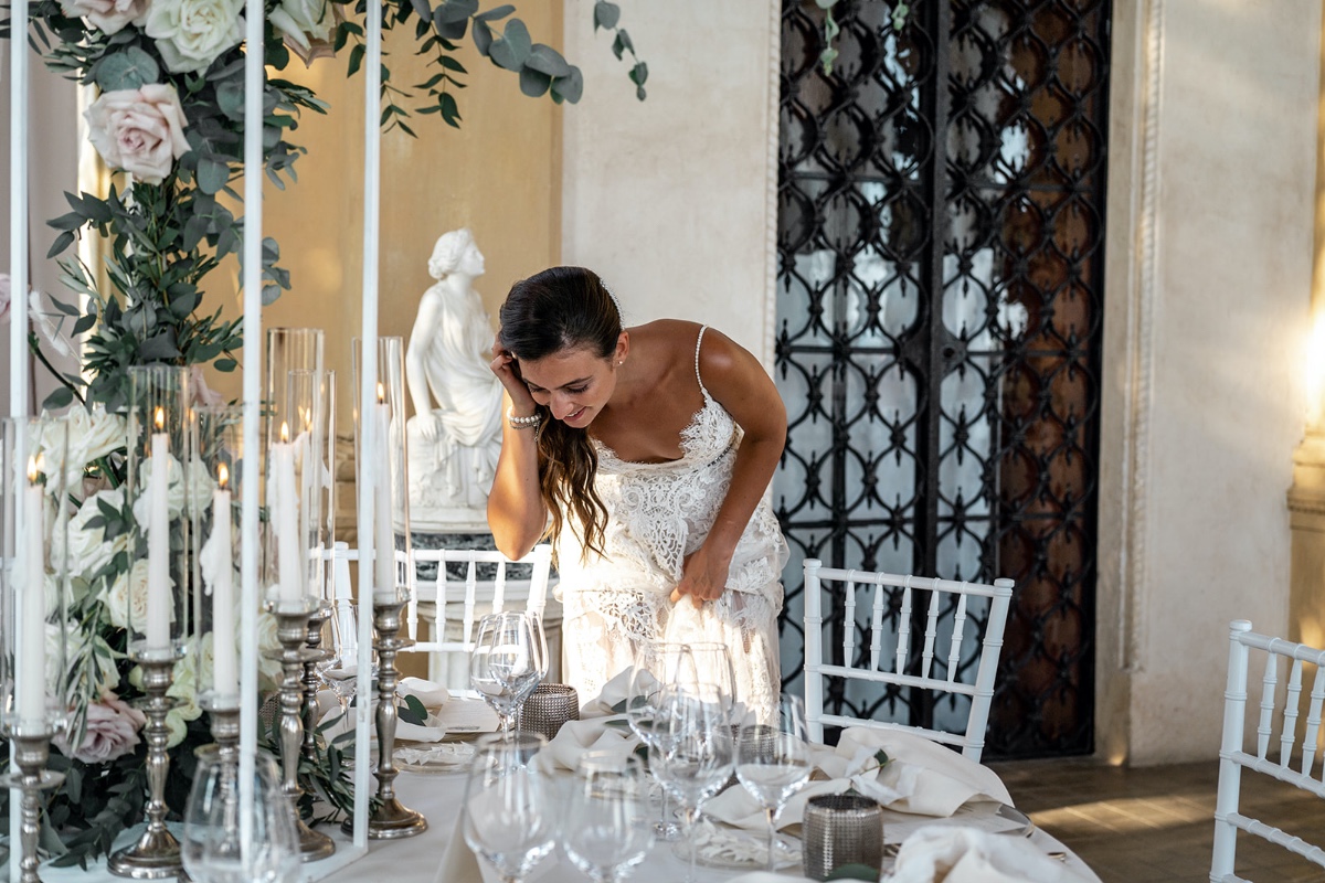 Bride admiring reception decor