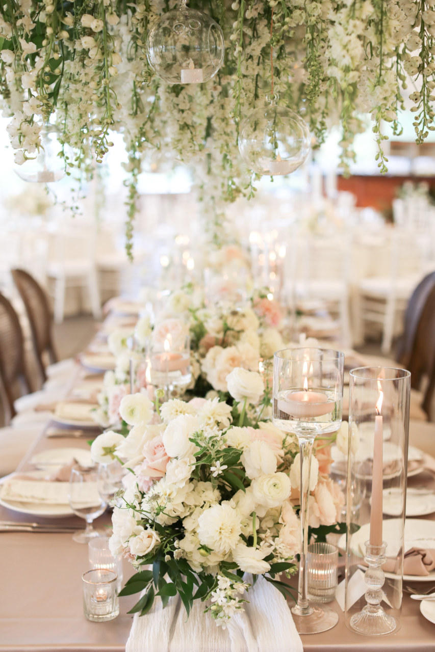 hanging floral installation at monochromatic wedding reception