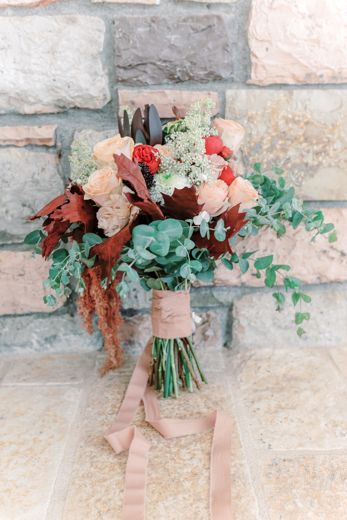 earth-toned bridal bouquet with pops of color