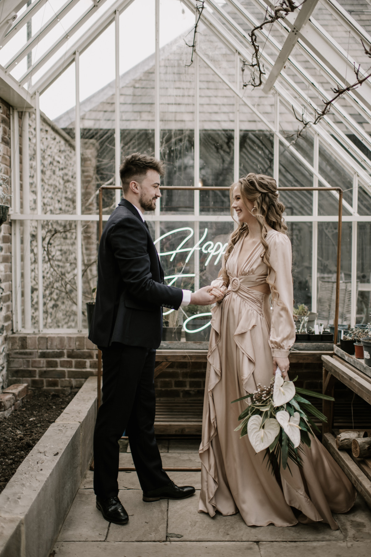 modern 70s inspired wedding in a greenhouse